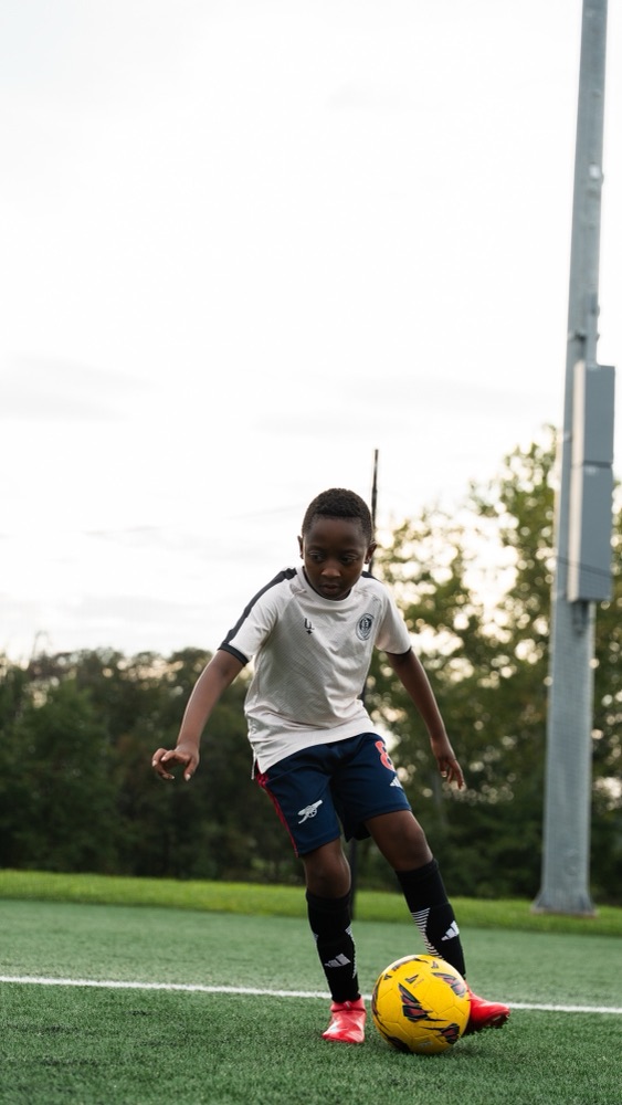 A player dribbling the ball during training