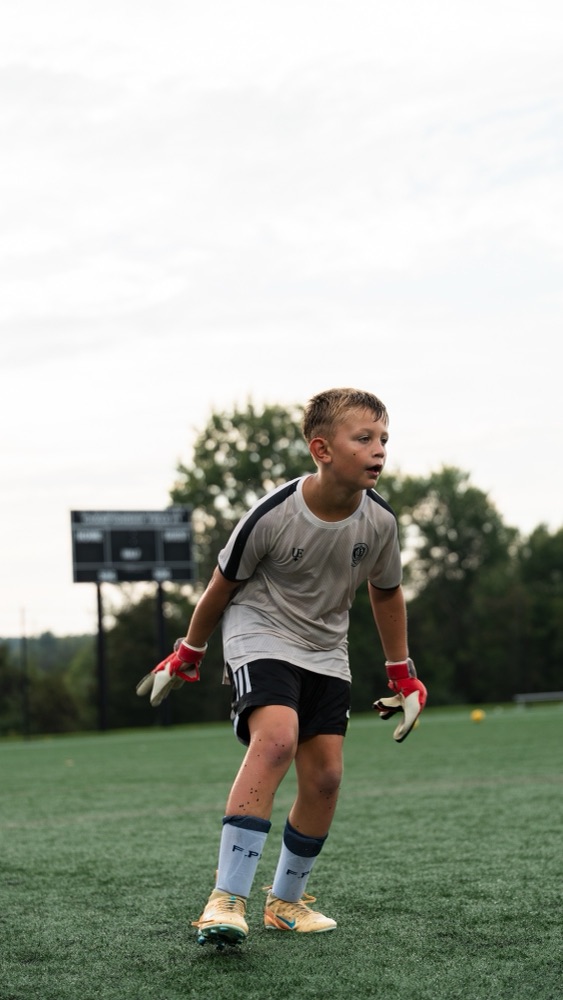 A goalkeeper moving into position during training